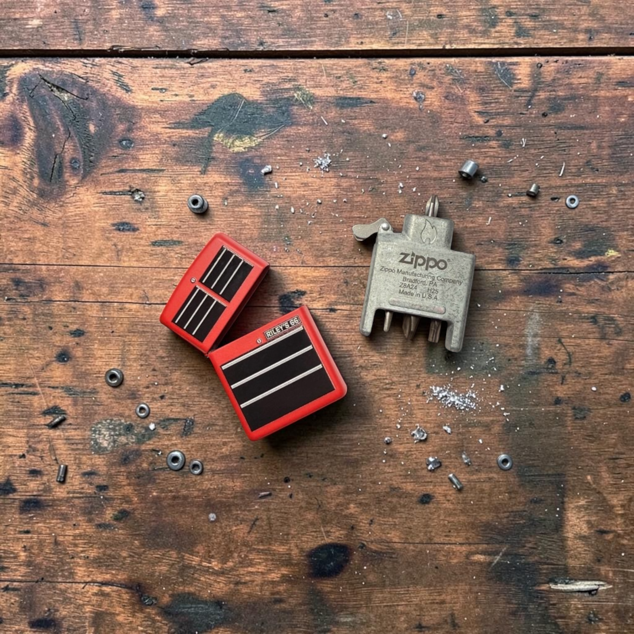 Collectible Zippo Bit Safe lighters featuring integrated screwdriver tools — original designs by Riley's 66