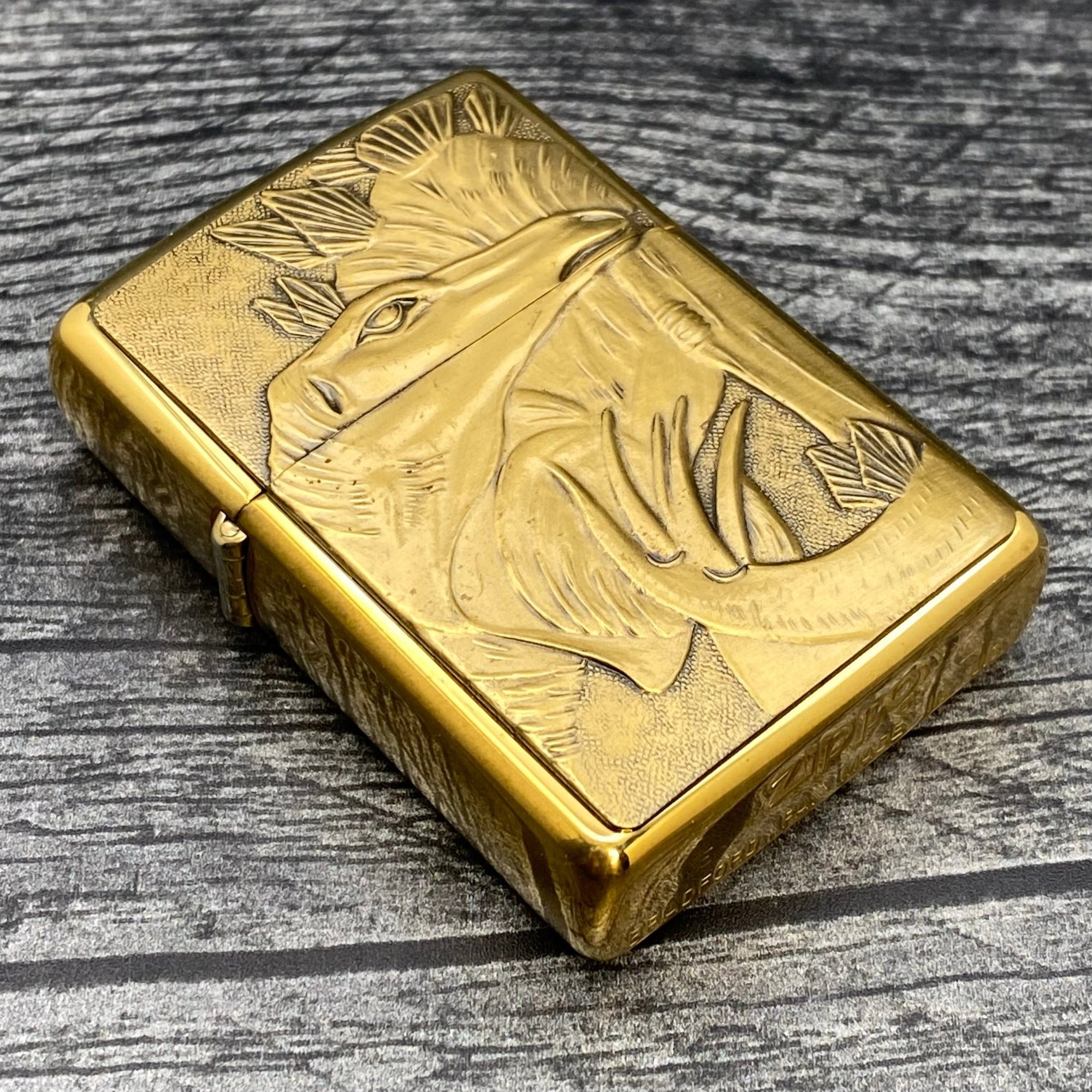 1993 Zippo Lighter - Stegosaurus - Barrett Smythe - High Polish Brass - Riley's 66 LLC