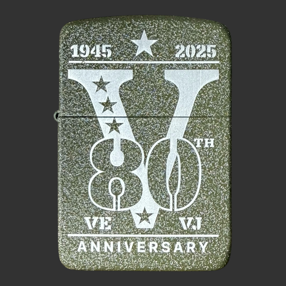2025 Zippo 80th Anniversary WWII Victory lighter – front view showing laser-engraved V for Victory design with 1945–2025 dates, VE VJ stars, and Anniversary text on olive green textured steel case
