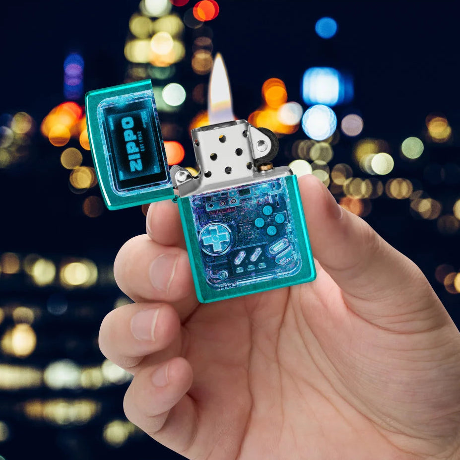 Candy Teal Game On Zippo lighter with retro translucent gaming-device design in hand.