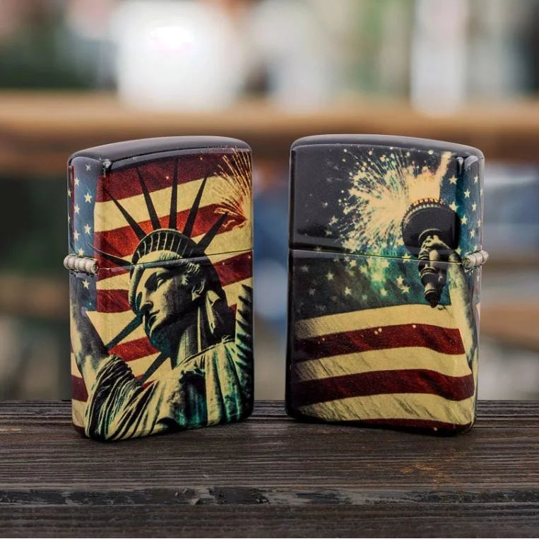 Tumbled Brass Spark of Liberty Zippo lighter with Statue of Liberty, American flag and fireworks design outdoor photo.
