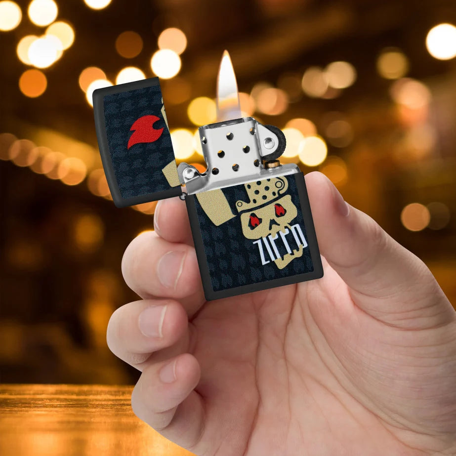 Black Matte Skull and Flames Zippo lighter with grinning skull and surrounding Zippo flame icons in hand.